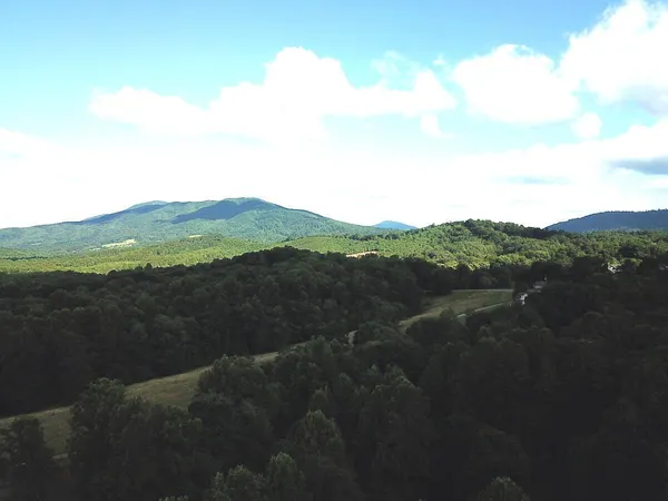 a view of mountain with lake view