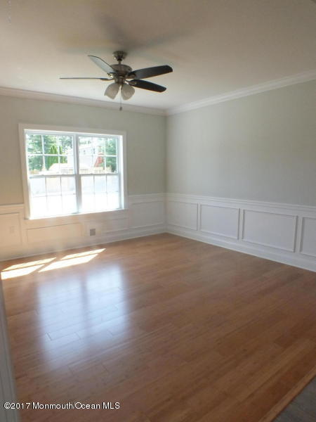 301 Leeward Road Manahawkin, NJ 08050 - Photo 7 of 11 an empty room with a empty space and a window