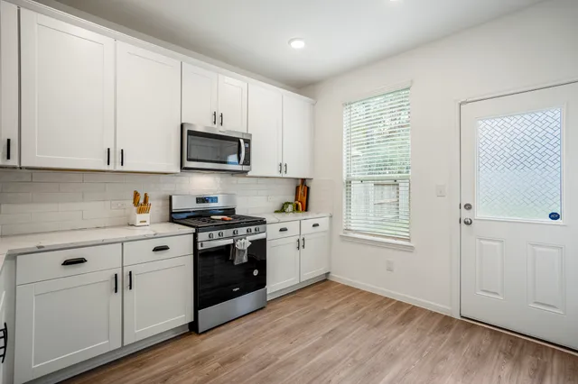 a view of a storage & utility room with wooden floor