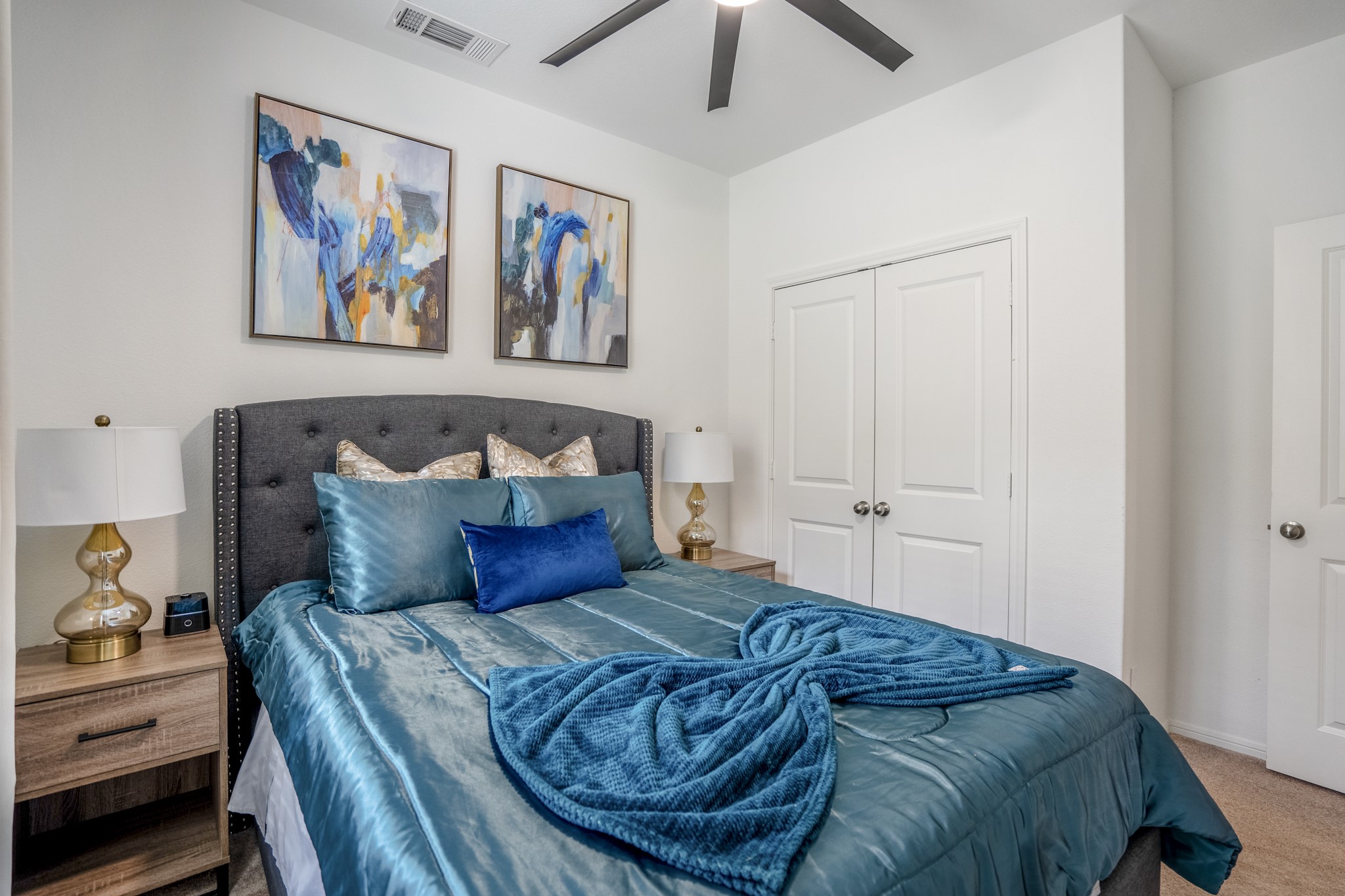 10477 Pineland Drive Willis, TX 77378 - Photo 13 of 27 a bedroom with a bed and a painting on the wall