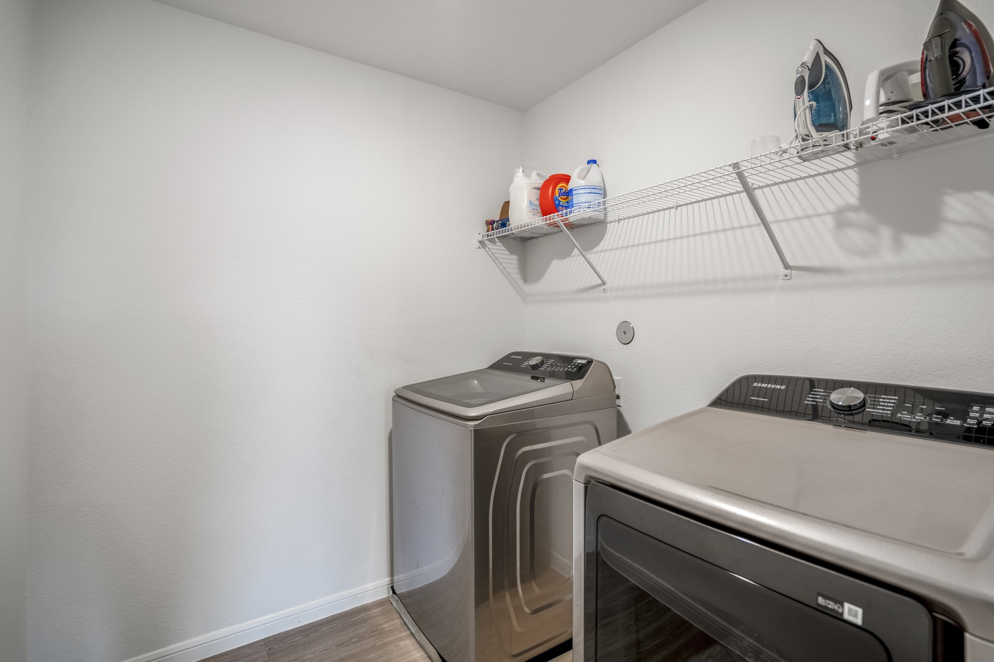 10477 Pineland Drive Willis, TX 77378 - Photo 22 of 27 a utility room with dryer and washer