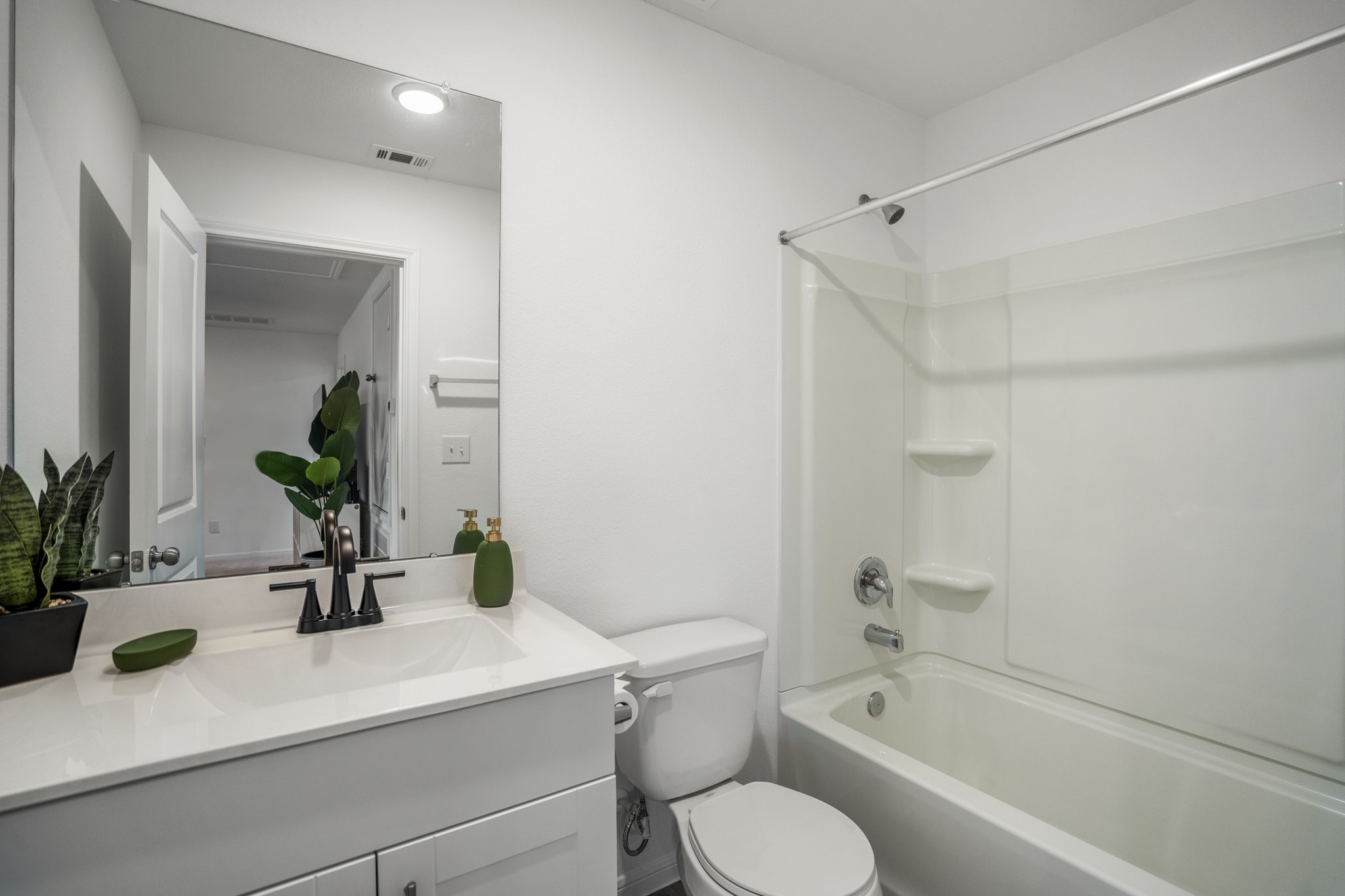 10477 Pineland Drive Willis, TX 77378 - Photo 23 of 27 a bathroom with a sink a toilet and shower