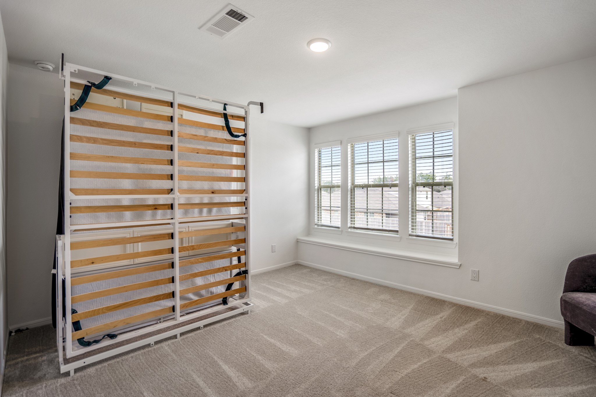 10477 Pineland Drive Willis, TX 77378 - Photo 25 of 27 a view of walk in closet with clothes and shoes