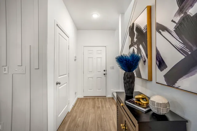 a view of entryway with wooden floor