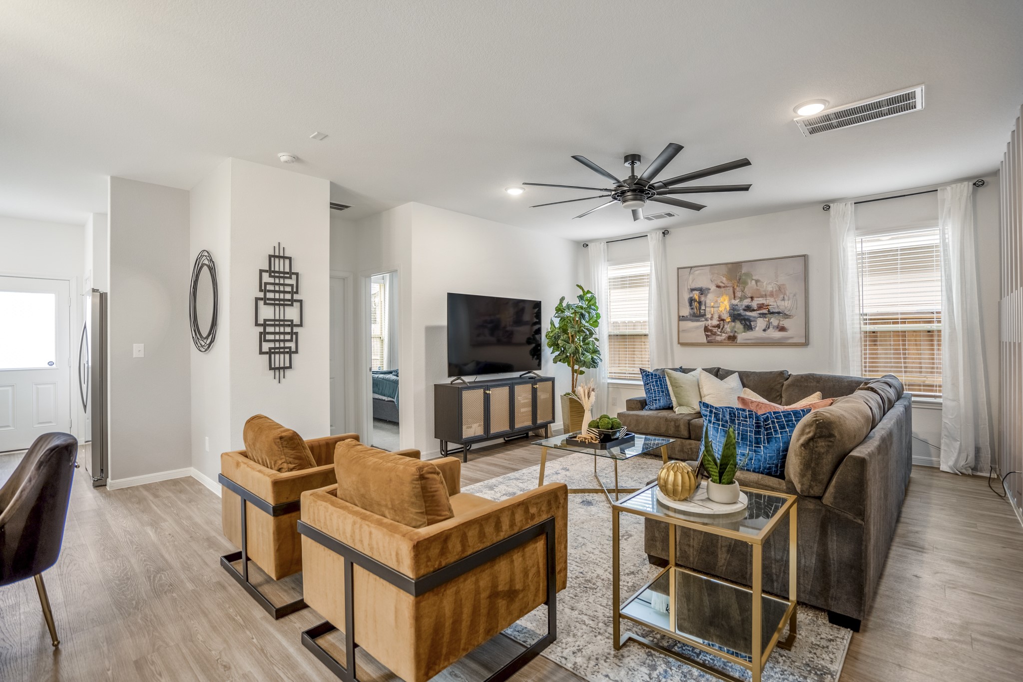 10477 Pineland Drive Willis, TX 77378 - Photo 5 of 27 a living room with furniture a flat screen tv and a window