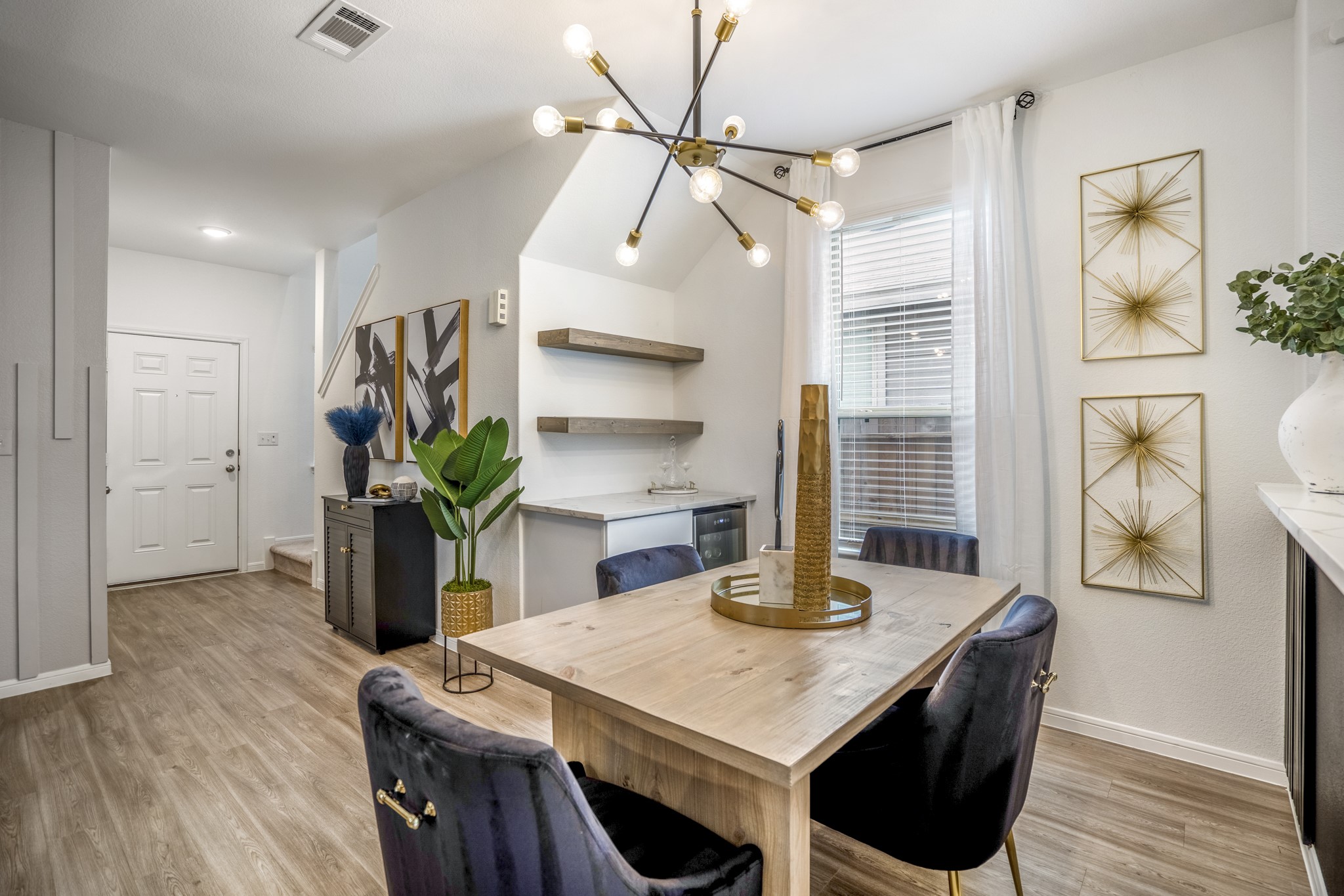 10477 Pineland Drive Willis, TX 77378 - Photo 7 of 27 a view of a dining room with furniture and wooden floor