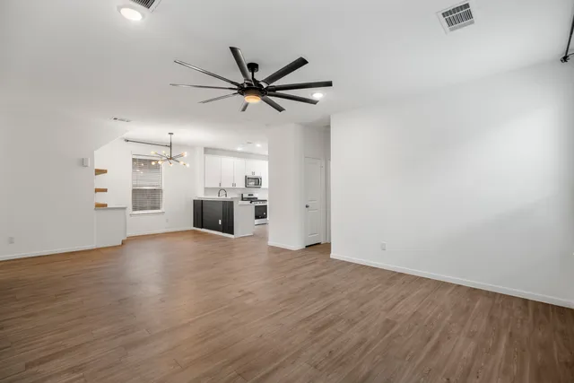 a bathroom with a sink toilet and a mirror