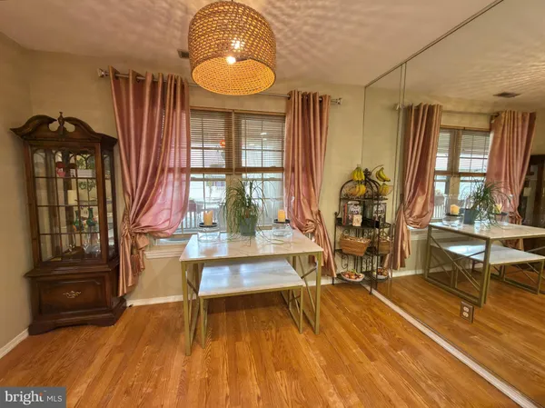 a view of a livingroom with furniture wooden floor and a rug