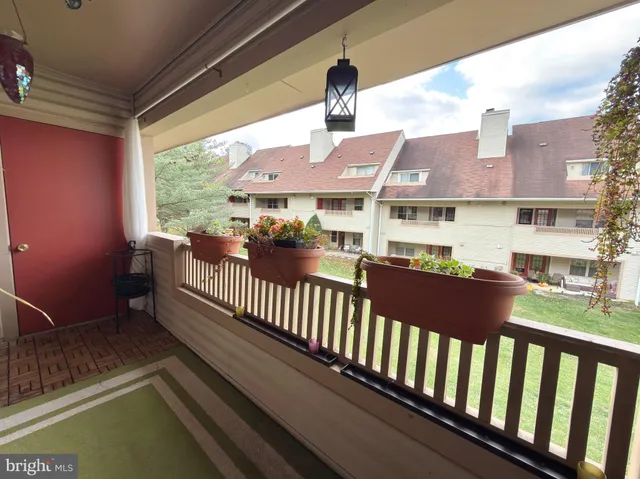a view of a balcony with wooden floor