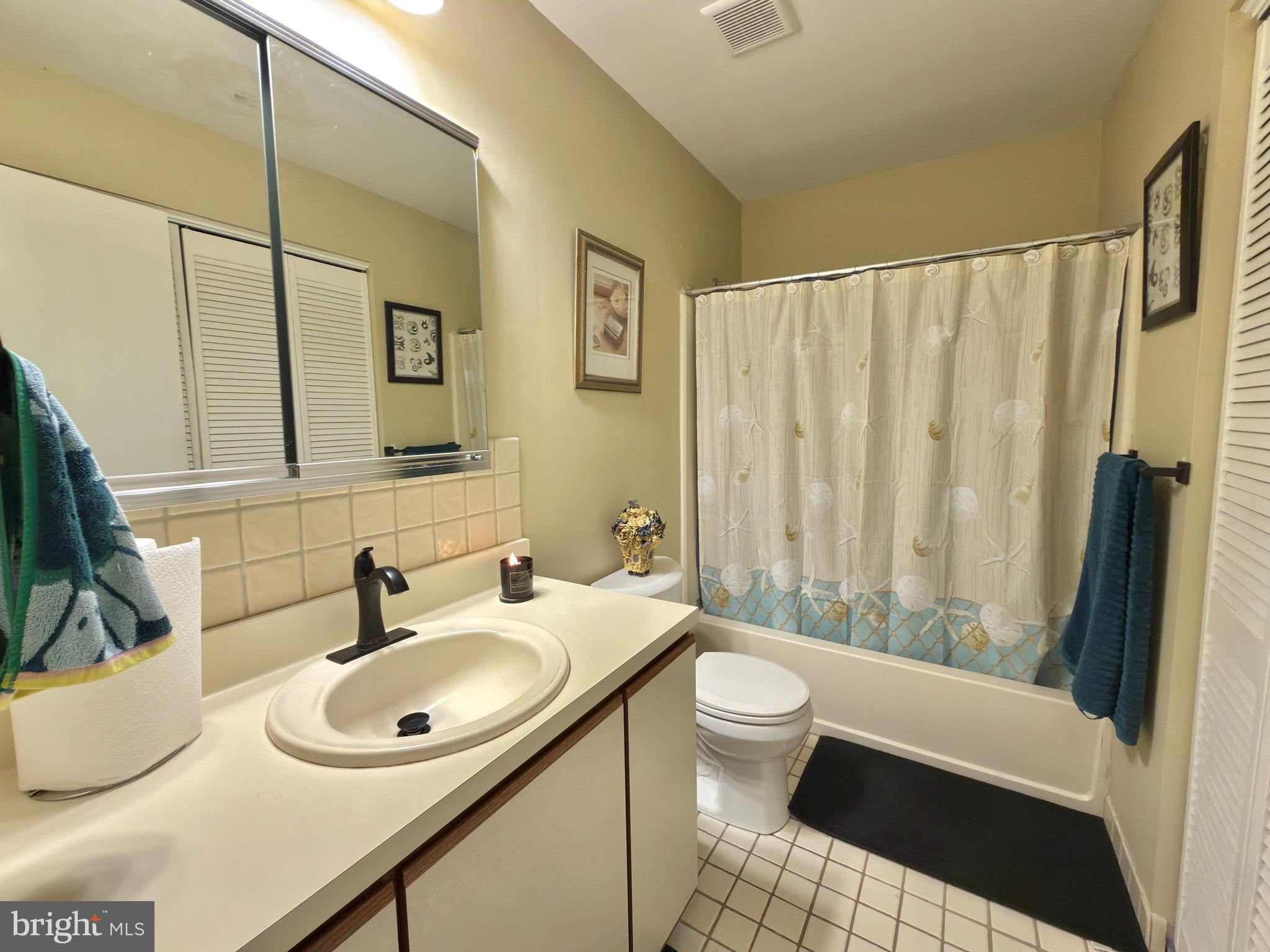 263 Tavistock Cherry Hill, NJ 08034 - Photo 26 of 33 a bathroom with a sink a toilet and a mirror