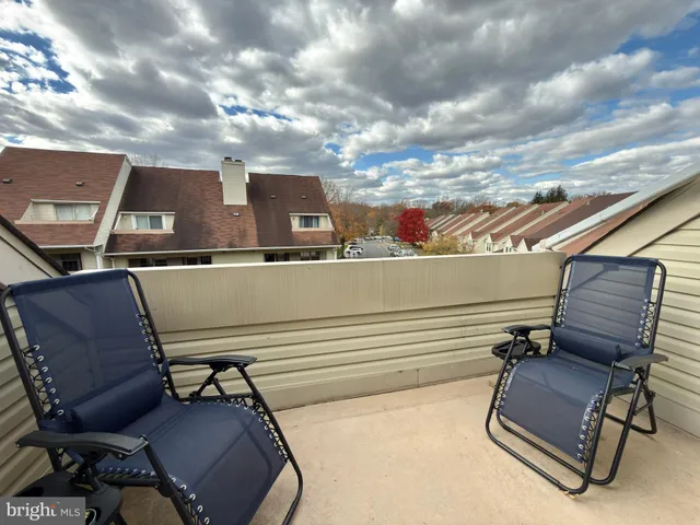 a view of a chairs in patio