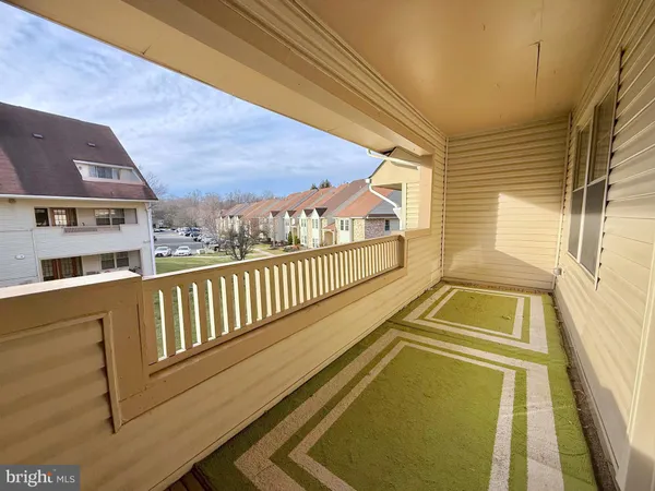 a view of balcony with a large window