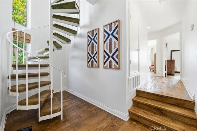 a view of a hallway with washer and dryer