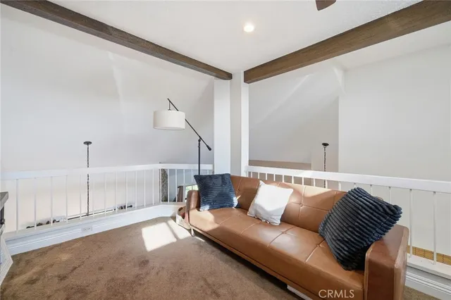 a couch sitting in a living room with a rug