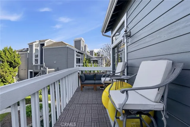 a view of a two chairs on the roof deck