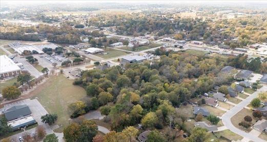 511 South Baker Street Lindale, TX 75771 - Photo 8 of 10 an aerial view of house with yard and mountain view in back