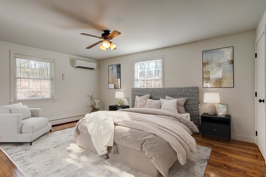 31 Sargent Road Bolton, MA 01740 - Photo 7 of 11 a bedroom with a bed and wooden floor