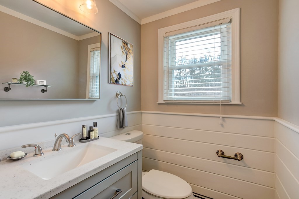 31 Sargent Road Bolton, MA 01740 - Photo 10 of 11 a bathroom with a sink vanity granite toilet and a mirror
