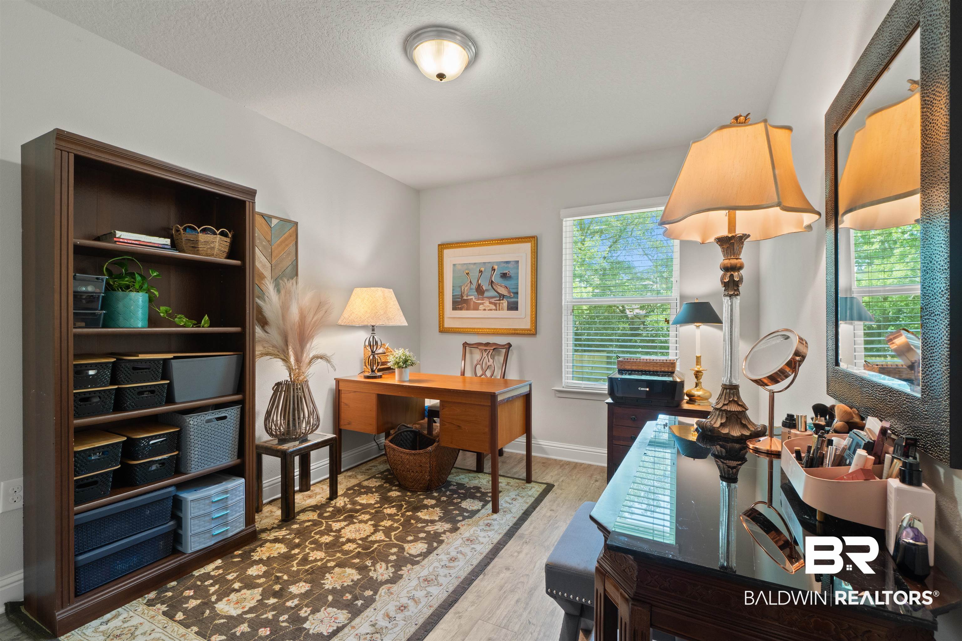 25806 Pollard Road, Unit 6 Daphne, AL 36526 - Photo 15 of 38 Dedicated room featuring a built-in dark wood bookcase, light wood-finish flooring, and a window with horizontal blinds