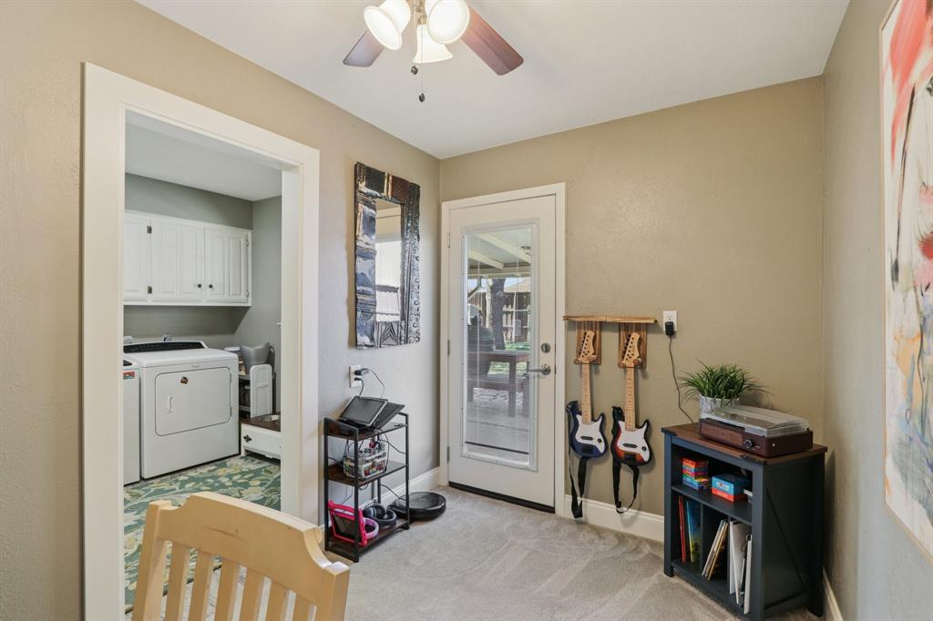 149 South Moore Road Coppell, TX 75019 - Photo 15 of 40 a room with furniture and a chandelier