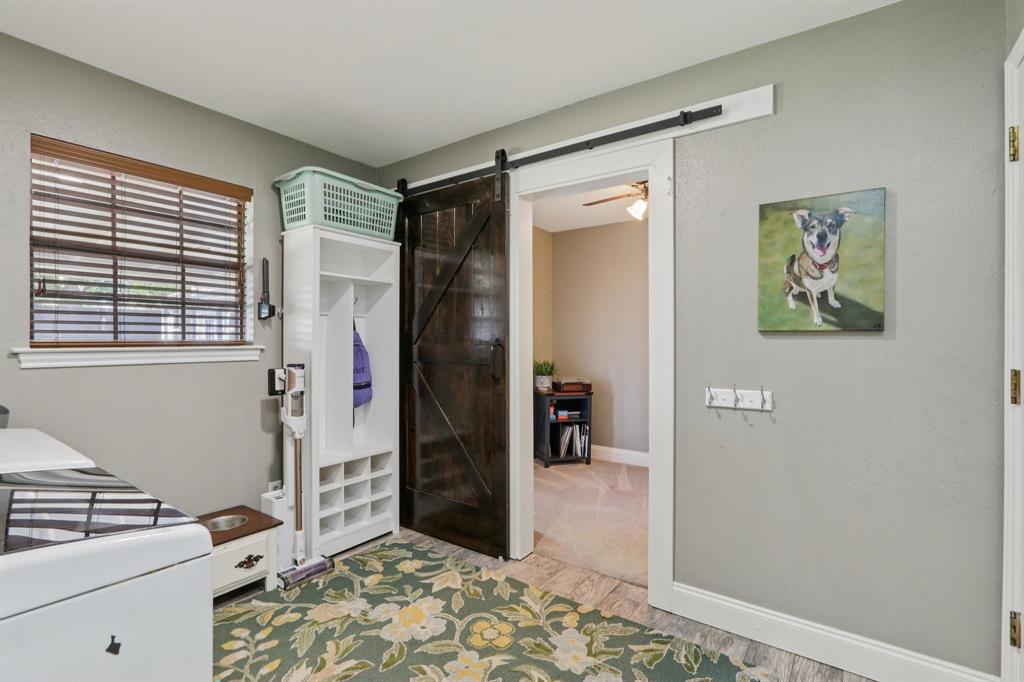 149 South Moore Road Coppell, TX 75019 - Photo 16 of 40 a bedroom with a bed and a window