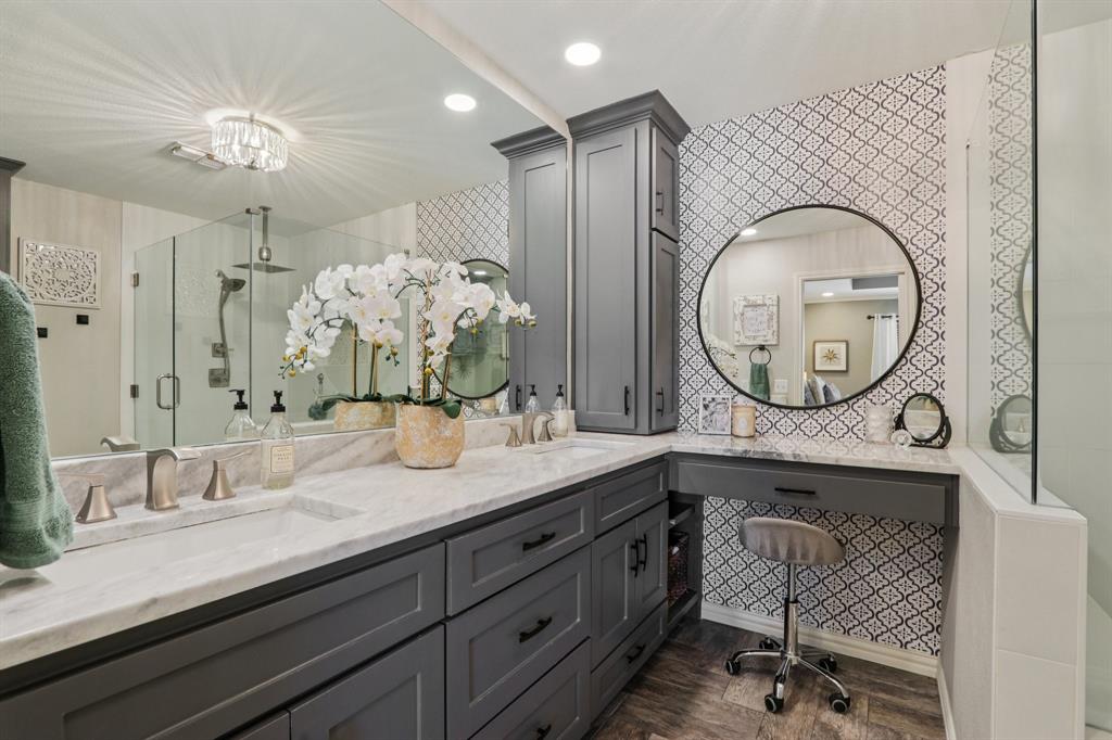 149 South Moore Road Coppell, TX 75019 - Photo 21 of 40 a bathroom with a granite countertop sink mirror and vanity