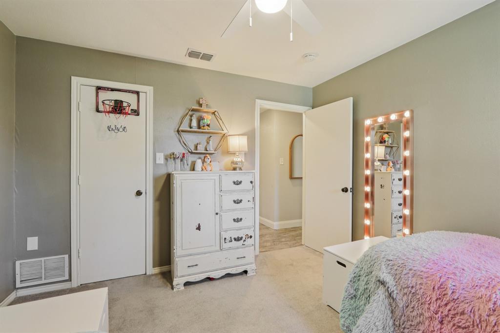 149 South Moore Road Coppell, TX 75019 - Photo 26 of 40 a bedroom with a bed and a window