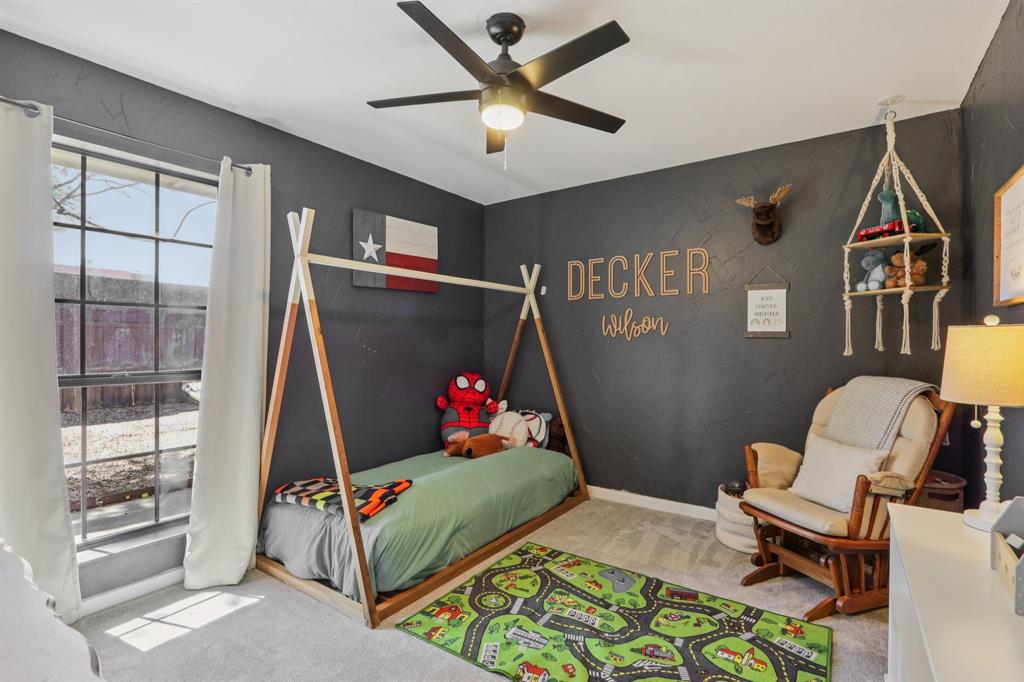 149 South Moore Road Coppell, TX 75019 - Photo 27 of 40 a living room with a couch and a window