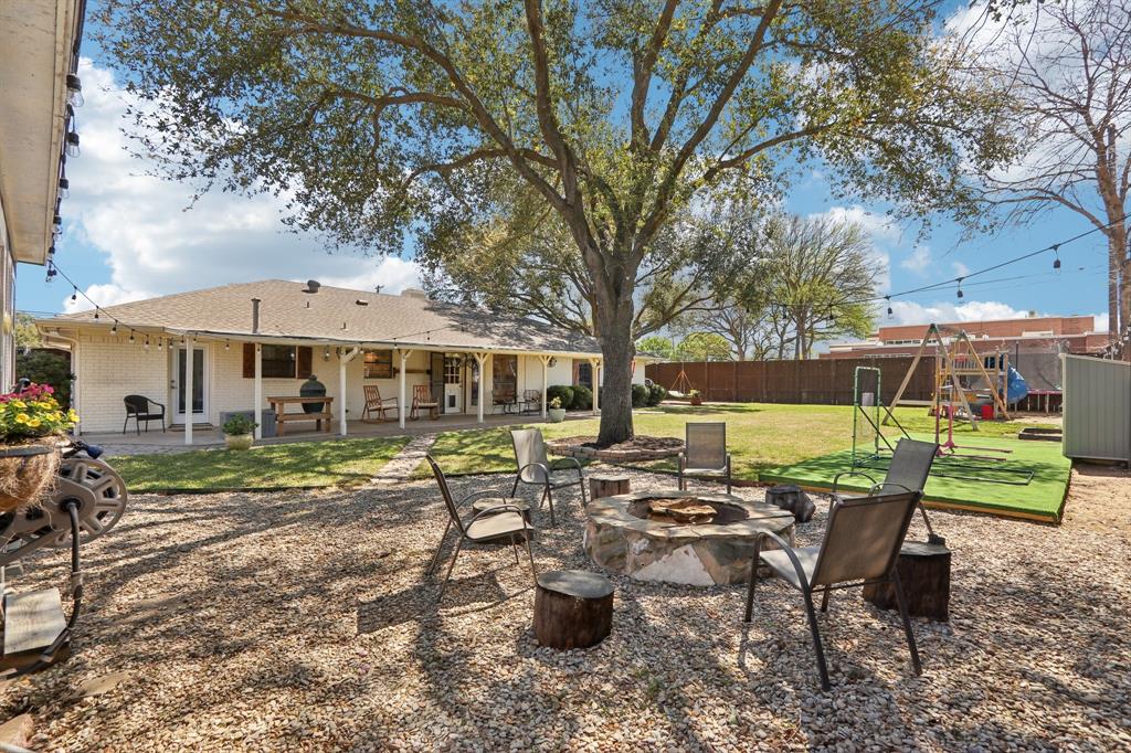 149 South Moore Road Coppell, TX 75019 - Photo 36 of 40 a view of a house with backyard sitting area and garden