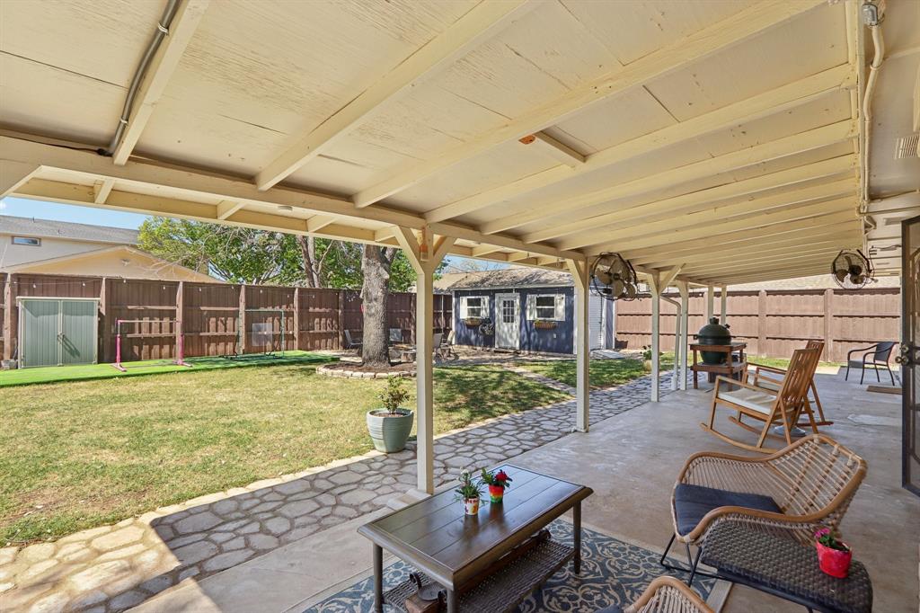 149 South Moore Road Coppell, TX 75019 - Photo 37 of 40 a view of a patio with table and chairs and potted plants
