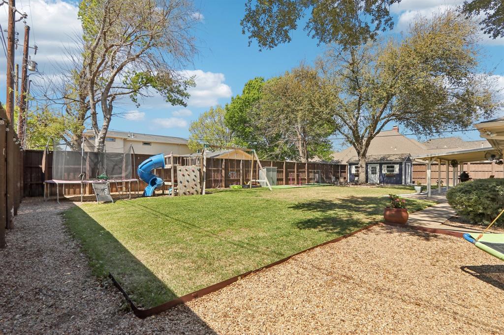 149 South Moore Road Coppell, TX 75019 - Photo 38 of 40 a front view of a house with garden