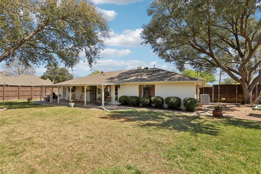 149 South Moore Road Coppell, TX 75019 - Photo 40 of 40 a front view of a house with a yard and trees