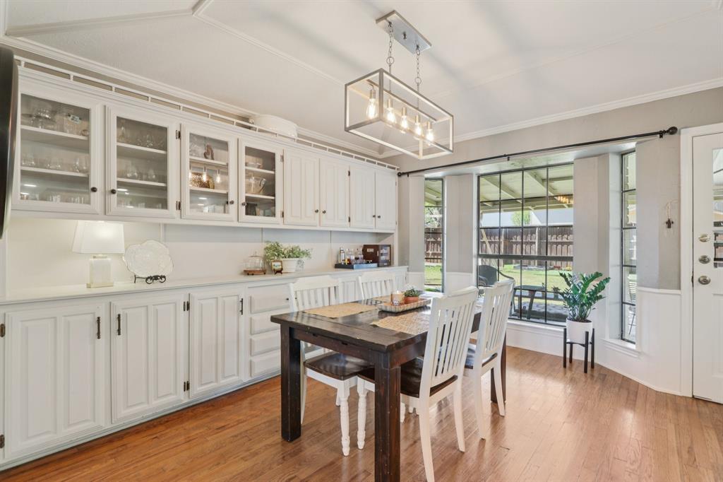 149 South Moore Road Coppell, TX 75019 - Photo 8 of 40 a view of a dining room with furniture window and wooden floor