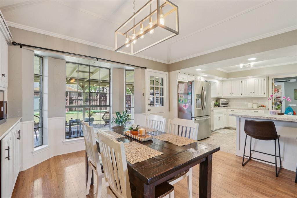 149 South Moore Road Coppell, TX 75019 - Photo 9 of 40 a view of a dining room with furniture window and wooden floor