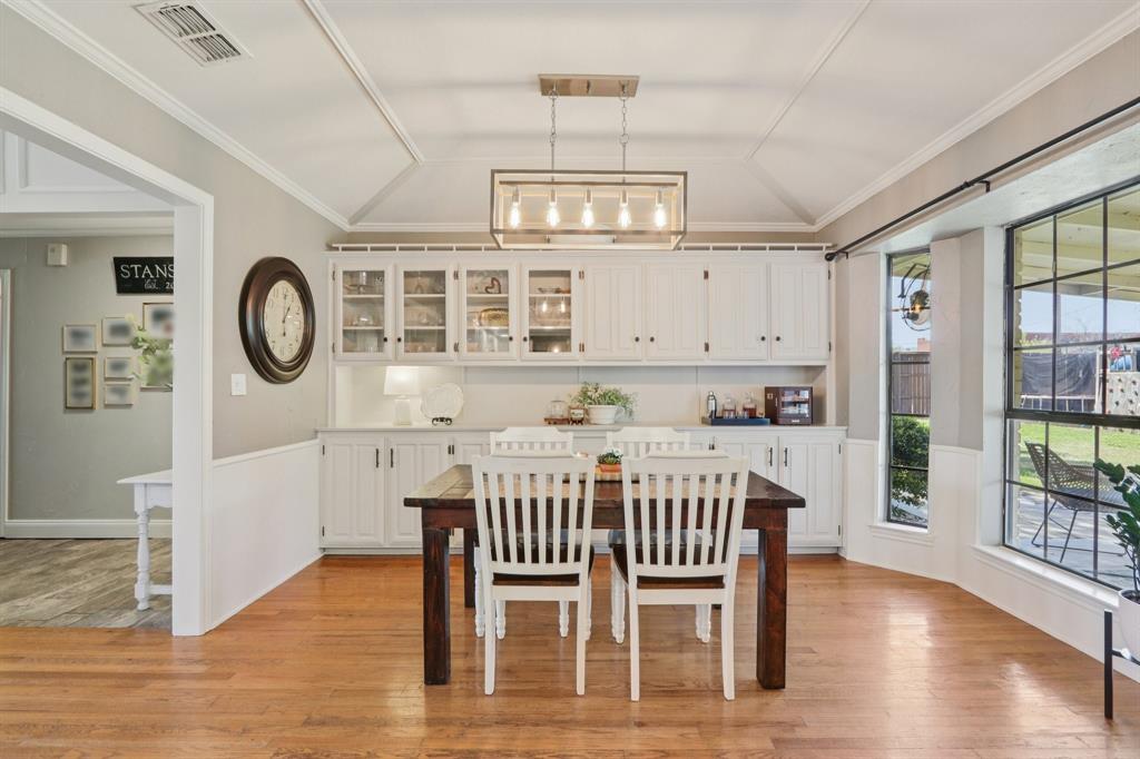 149 South Moore Road Coppell, TX 75019 - Photo 10 of 40 a view of a dining room with furniture window and wooden floor