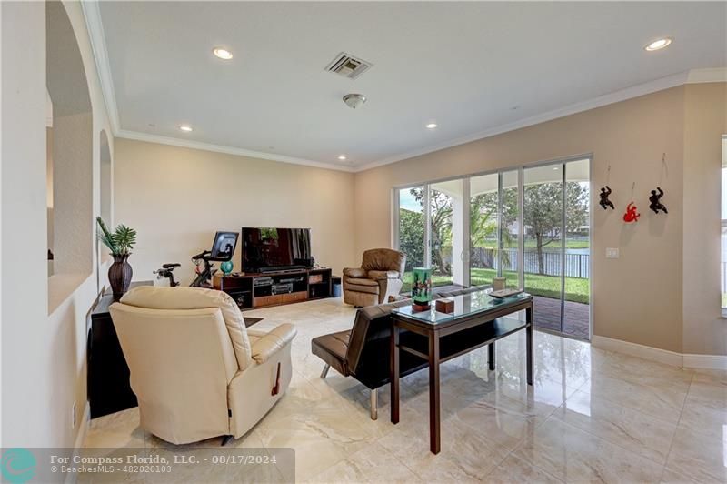 8631 Lakeside Bend Parkland, FL 33076 - Photo 12 of 71 a living room with furniture and a large window