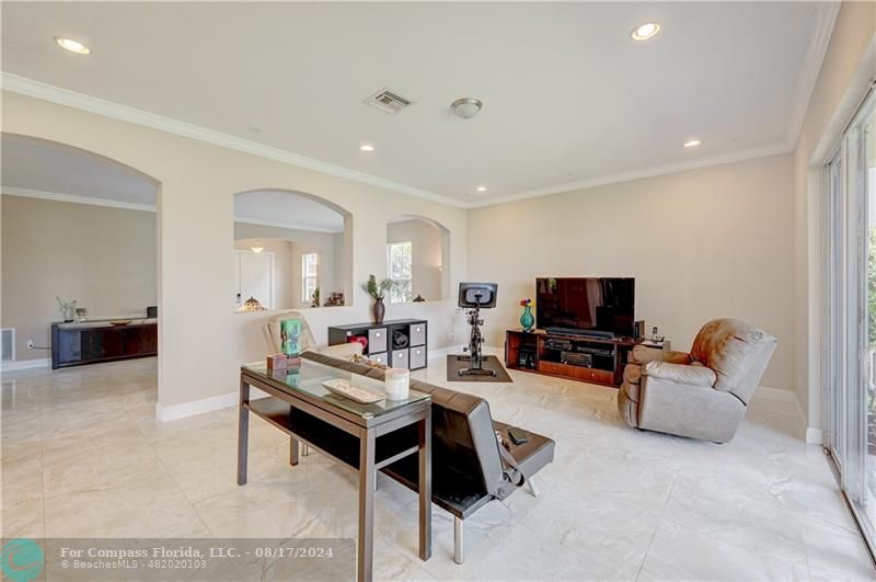 8631 Lakeside Bend Parkland, FL 33076 - Photo 14 of 71 a living room with furniture and a flat screen tv