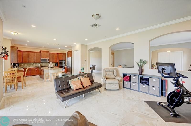 8631 Lakeside Bend Parkland, FL 33076 - Photo 15 of 71 a living room with furniture and a large mirror