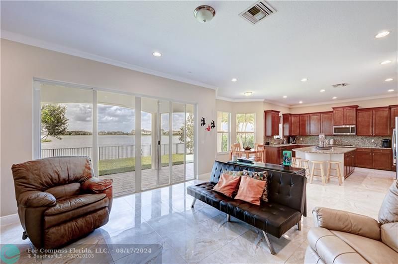 8631 Lakeside Bend Parkland, FL 33076 - Photo 16 of 71 a living room with furniture and a large window