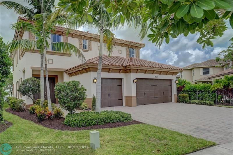 8631 Lakeside Bend Parkland, FL 33076 - Photo 2 of 71 a front view of a house with a garden and plants