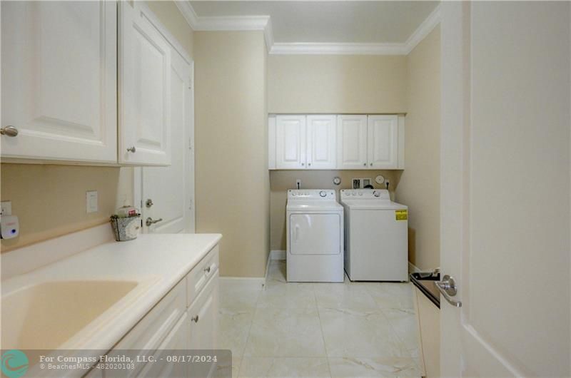 8631 Lakeside Bend Parkland, FL 33076 - Photo 23 of 71 a utility room with a sink washer and dryer