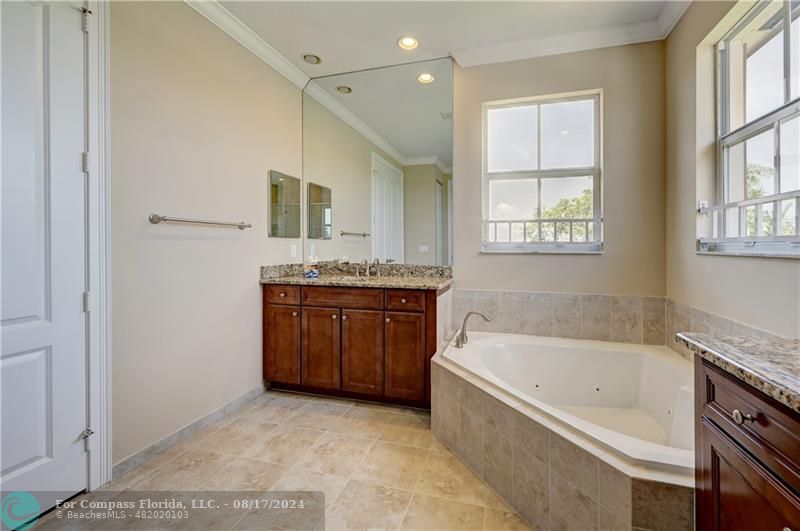 8631 Lakeside Bend Parkland, FL 33076 - Photo 36 of 71 a spacious bathroom with a tub sink and mirror
