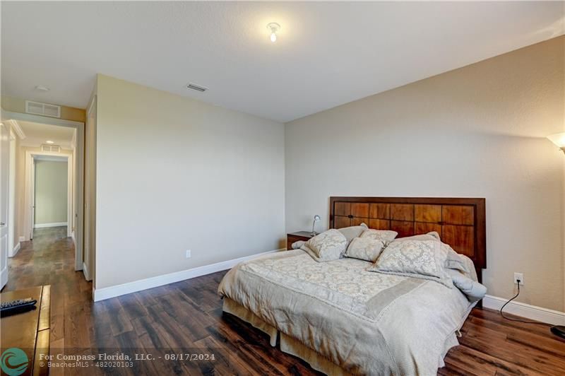 8631 Lakeside Bend Parkland, FL 33076 - Photo 46 of 71 a bed sitting in a bedroom next to a window