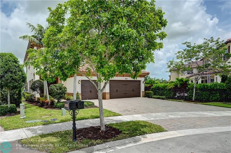 8631 Lakeside Bend Parkland, FL 33076 - Photo 5 of 71 a front view of a house with garden
