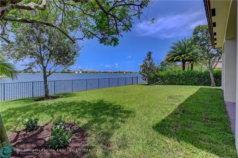 8631 Lakeside Bend Parkland, FL 33076 - Photo 53 of 71 a view of yard with green space and wooden fence