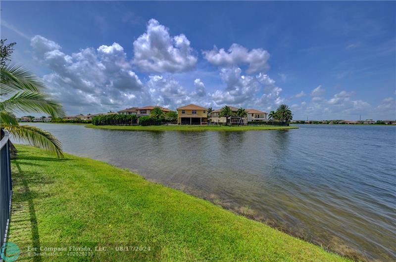 8631 Lakeside Bend Parkland, FL 33076 - Photo 58 of 71 a view of a lake with houses in the back