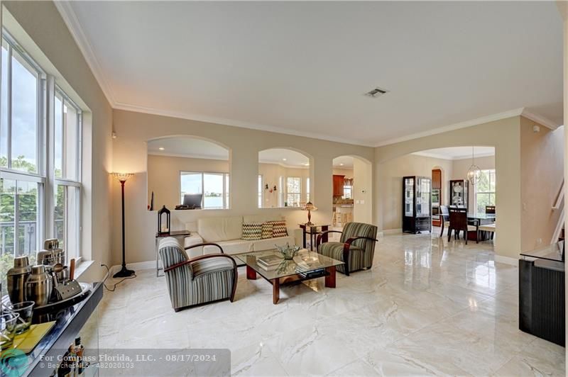 8631 Lakeside Bend Parkland, FL 33076 - Photo 8 of 71 a living room with furniture and a large window