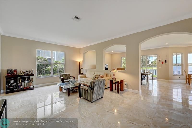 8631 Lakeside Bend Parkland, FL 33076 - Photo 9 of 71 a living room with furniture large window and a table