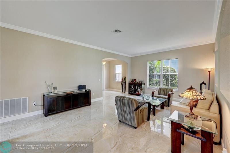 8631 Lakeside Bend Parkland, FL 33076 - Photo 10 of 71 a living room with furniture and a flat screen tv