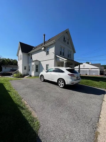 a car parked in front of a house